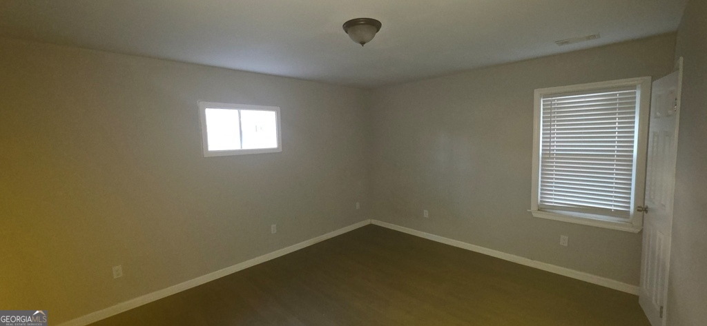 1032 Valley View Road Southeast Atlanta, GA 30315 - Photo 11 of 15 an empty room with a window