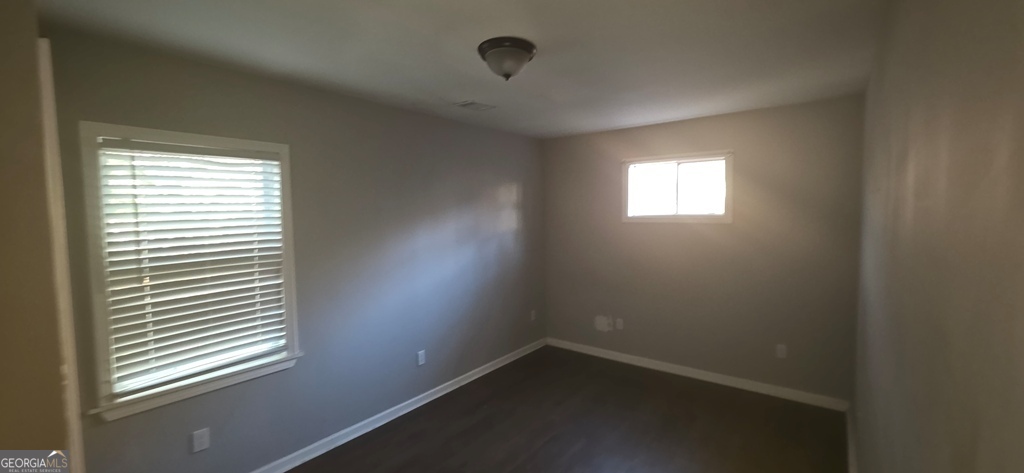 1032 Valley View Road Southeast Atlanta, GA 30315 - Photo 13 of 15 an empty room with a window