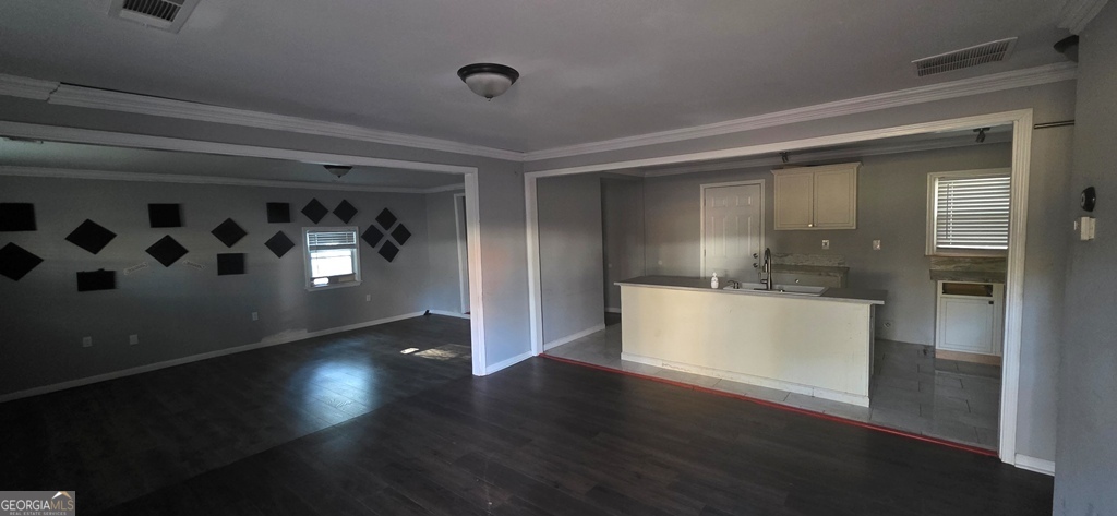 1032 Valley View Road Southeast Atlanta, GA 30315 - Photo 3 of 15 a view of an empty room and kitchen with a dishwasher