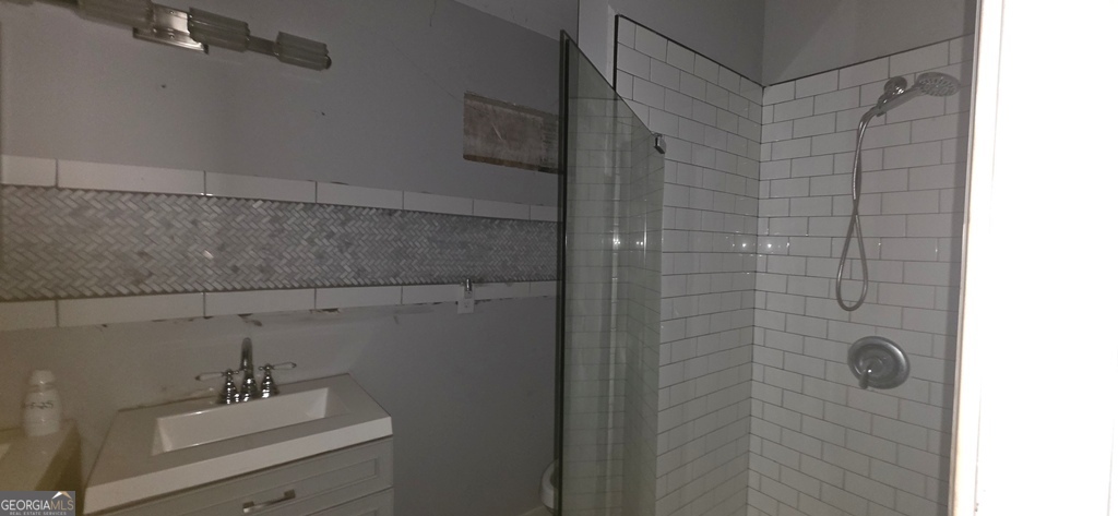 1032 Valley View Road Southeast Atlanta, GA 30315 - Photo 6 of 15 a bathroom with a shower and sink