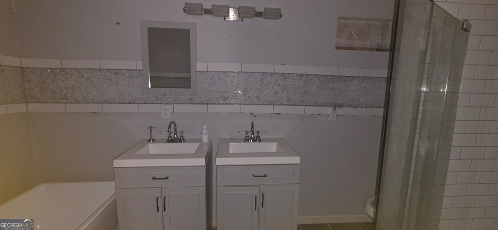 1032 Valley View Road Southeast Atlanta, GA 30315 - Photo 7 of 15 a bathroom with a sink and a toilet