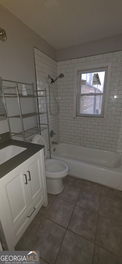 1032 Valley View Road Southeast Atlanta, GA 30315 - Photo 10 of 15 a bathroom with a sink a toilet and shower