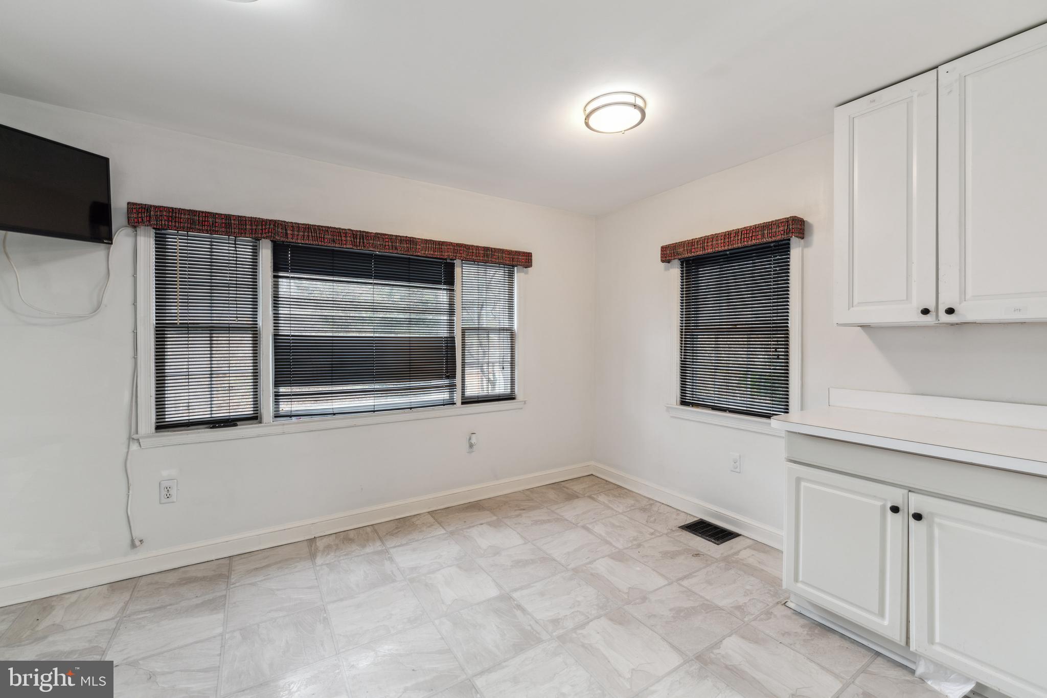 9222 Glenville Road Silver Spring, MD 20901 - Photo 13 of 15 a view of empty room with window and fireplace