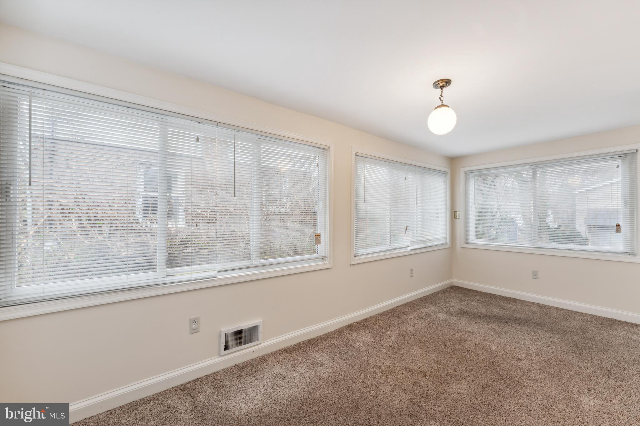 9222 Glenville Road Silver Spring, MD 20901 - Photo 3 of 15 a view of an empty room with a window