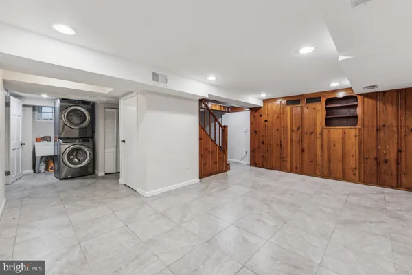 a view of a storage & utility room with stainless steel appliances