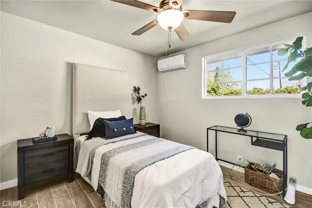 a bedroom with a bed and a table