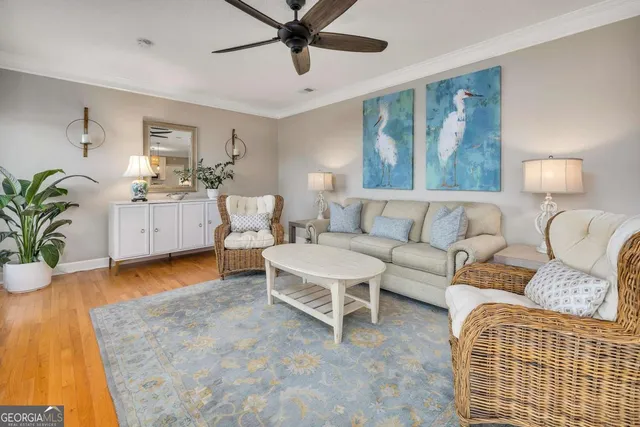 a living room with furniture and a rug