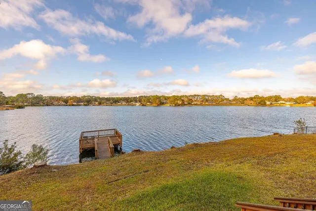 a view of a balcony with furniture and wooden floor