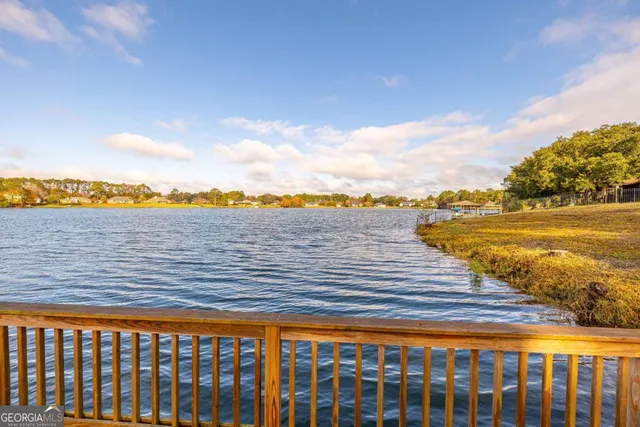 a view of a swimming pool with an outdoor seating