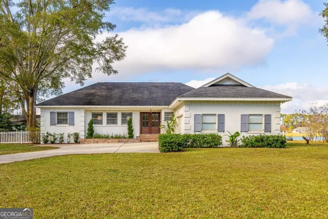 a front view of a house with a yard