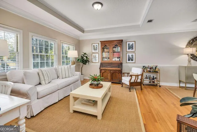a living room with furniture and a table