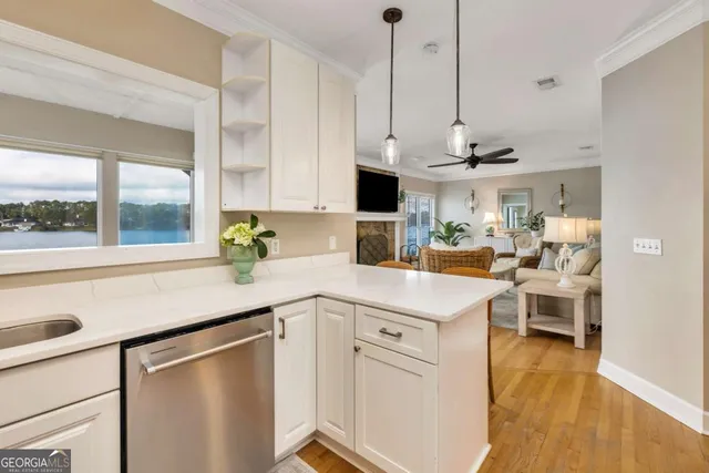 a kitchen with stainless steel appliances and white cabinets