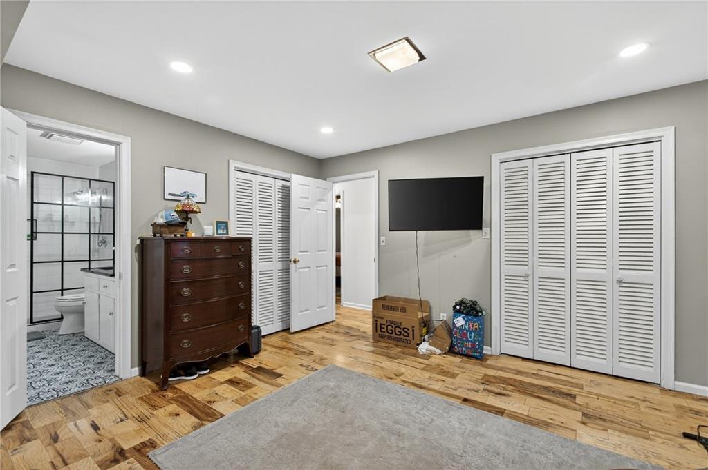 200 Cherry Hill Circle Calhoun, GA 30701 - Photo 24 of 61 a bedroom with furniture and a flat screen tv