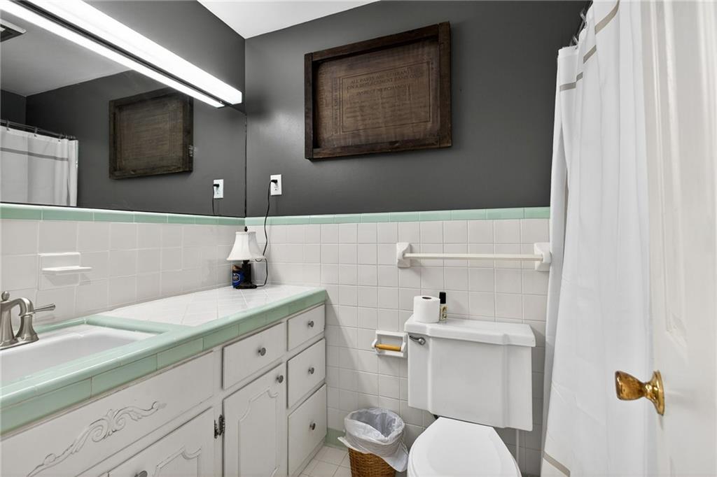200 Cherry Hill Circle Calhoun, GA 30701 - Photo 28 of 61 a bathroom with a sink a toilet and mirror