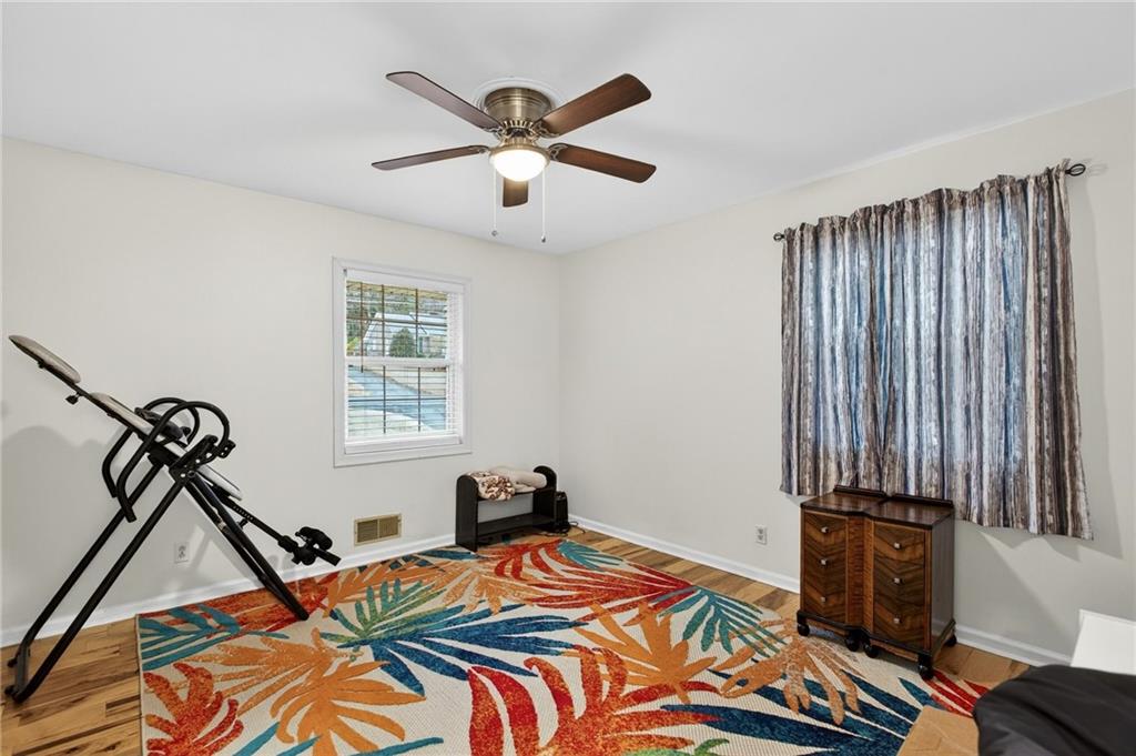 200 Cherry Hill Circle Calhoun, GA 30701 - Photo 29 of 61 a bed sitting in a bedroom next to a window