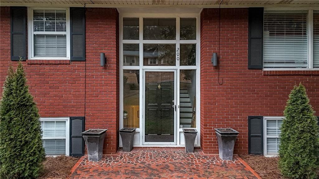 200 Cherry Hill Circle Calhoun, GA 30701 - Photo 7 of 61 a brick building with a bench in front of door