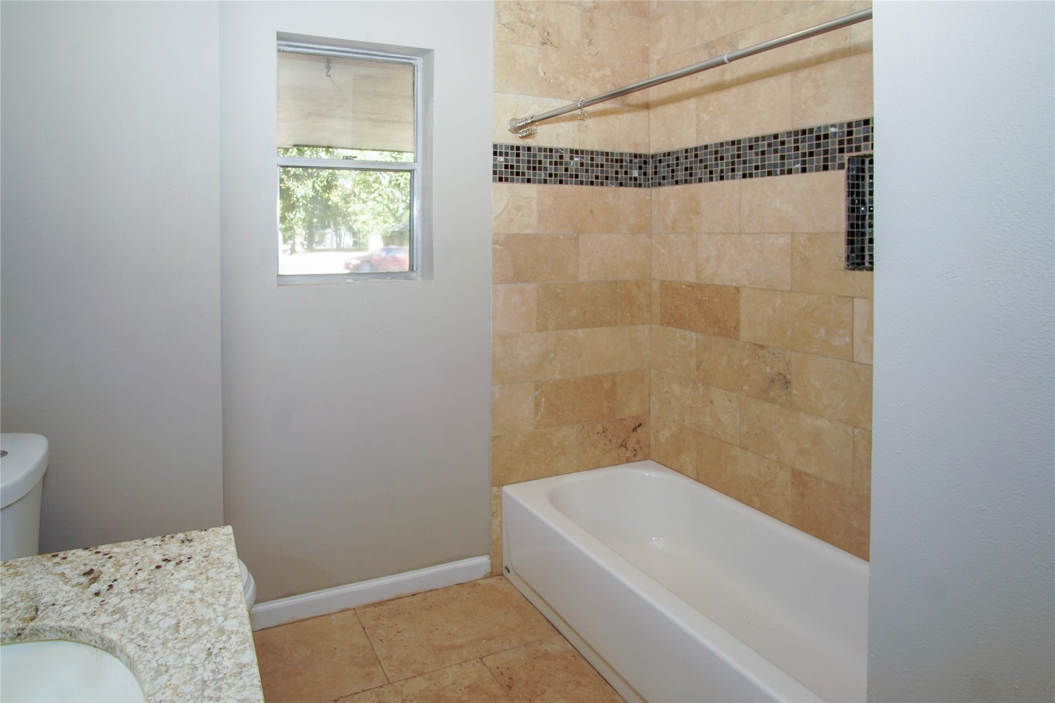 1926 16th Street Hempstead, TX 77445 - Photo 18 of 19 a bathroom with a bathtub and a shower
