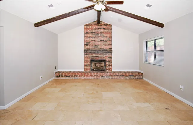a view of an empty room with windows