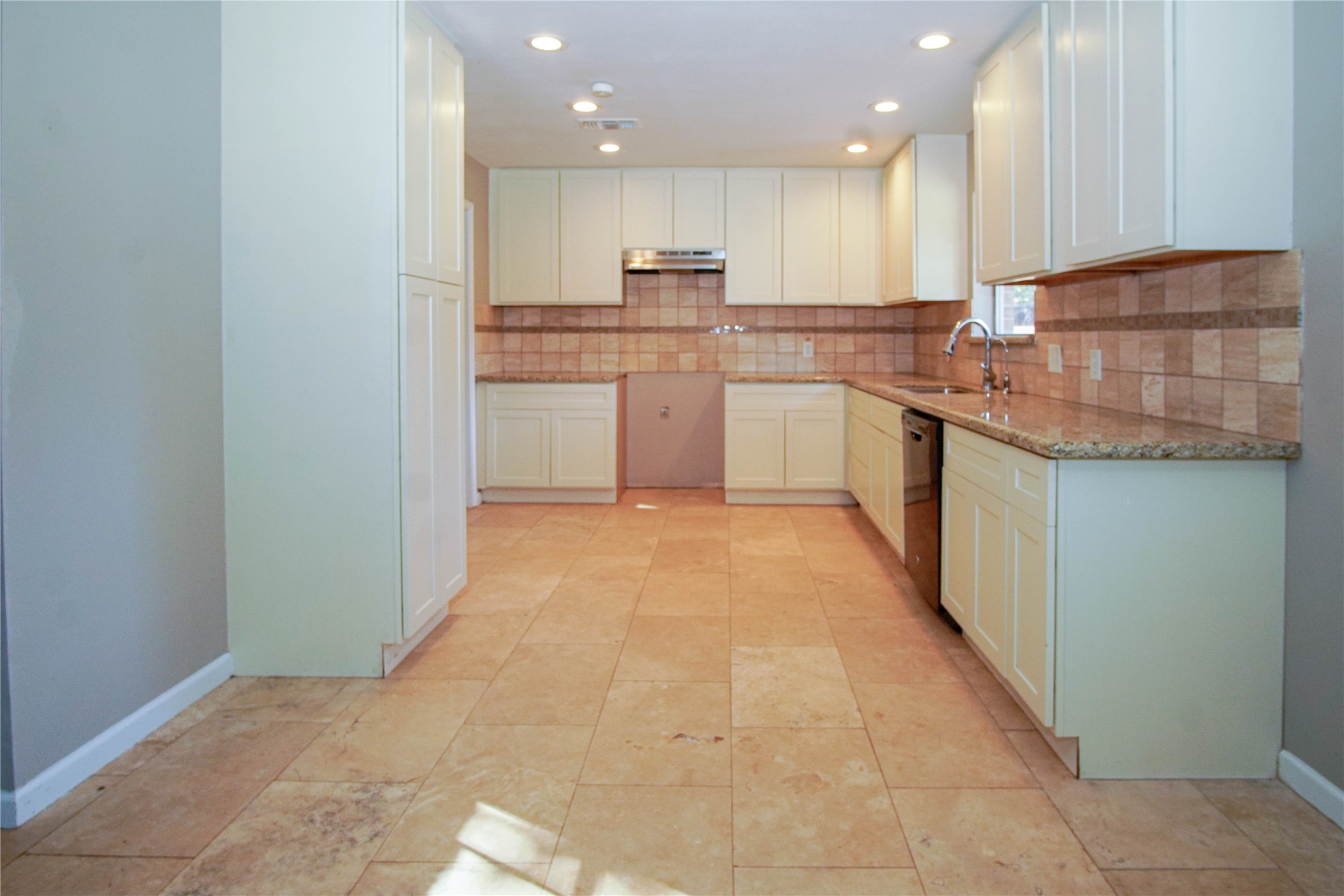 1926 16th Street Hempstead, TX 77445 - Photo 5 of 19 a large kitchen with stainless steel appliances granite countertop a stove a sink and a microwave