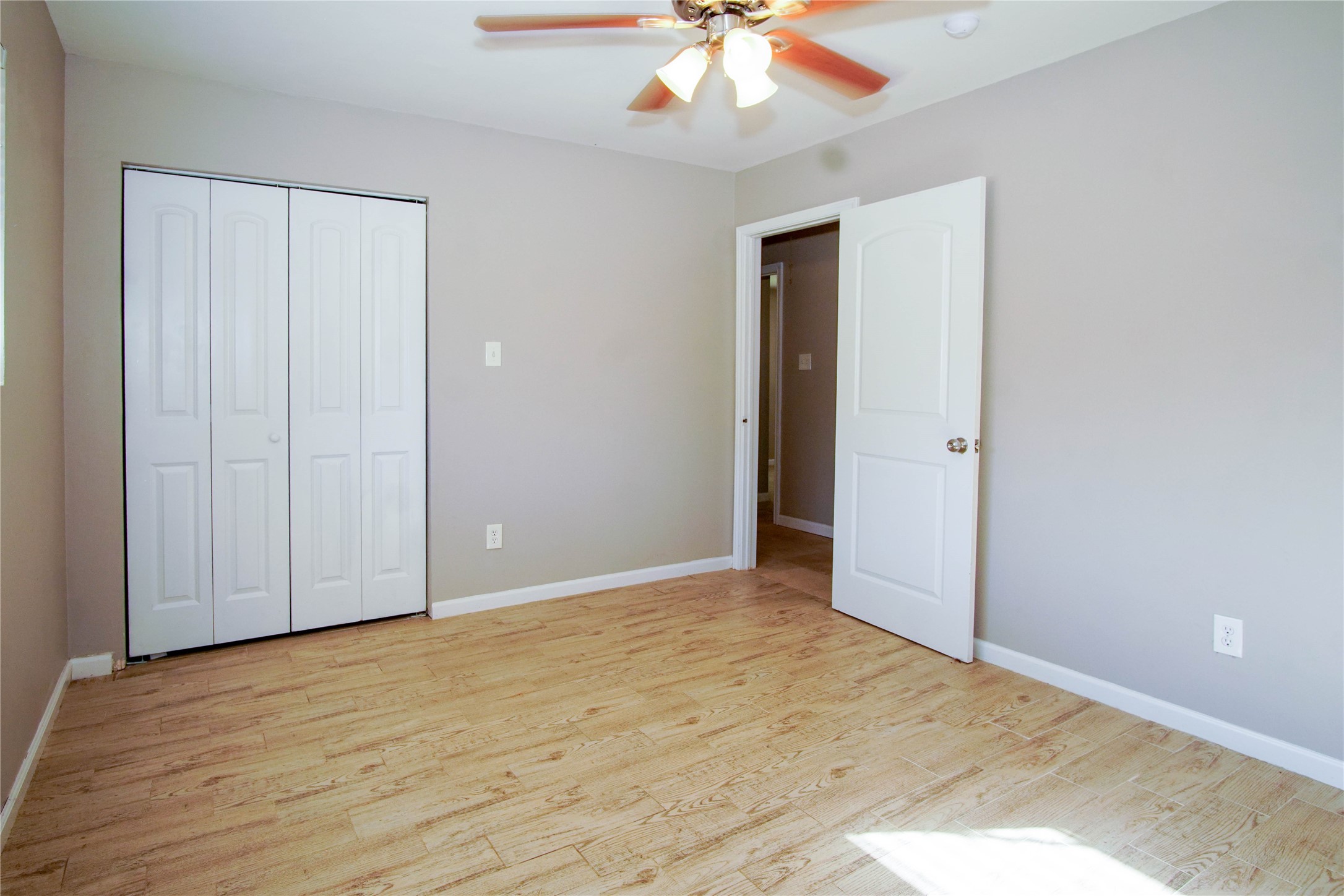 1926 16th Street Hempstead, TX 77445 - Photo 7 of 19 a view of an empty room with wooden floor