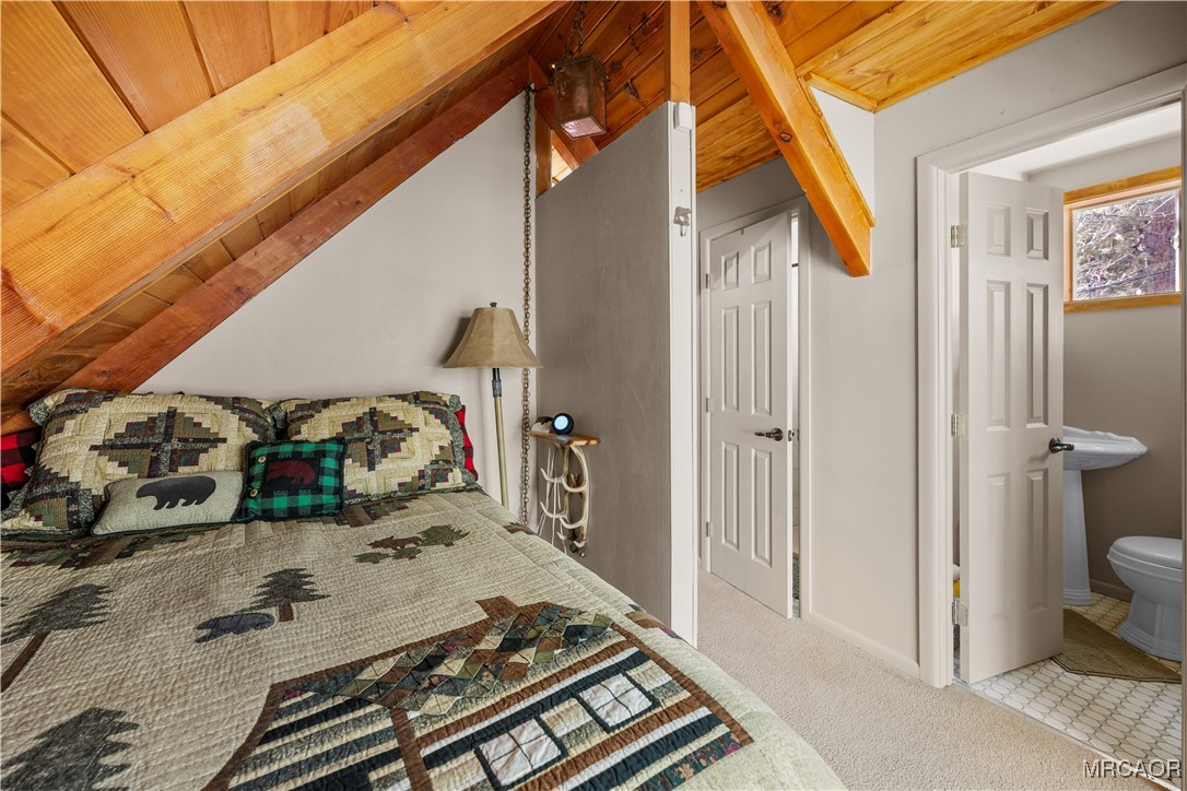 1289 Canyon Road Fawnskin, CA 92333 - Photo 19 of 23 a view of a bedroom with two washing machine