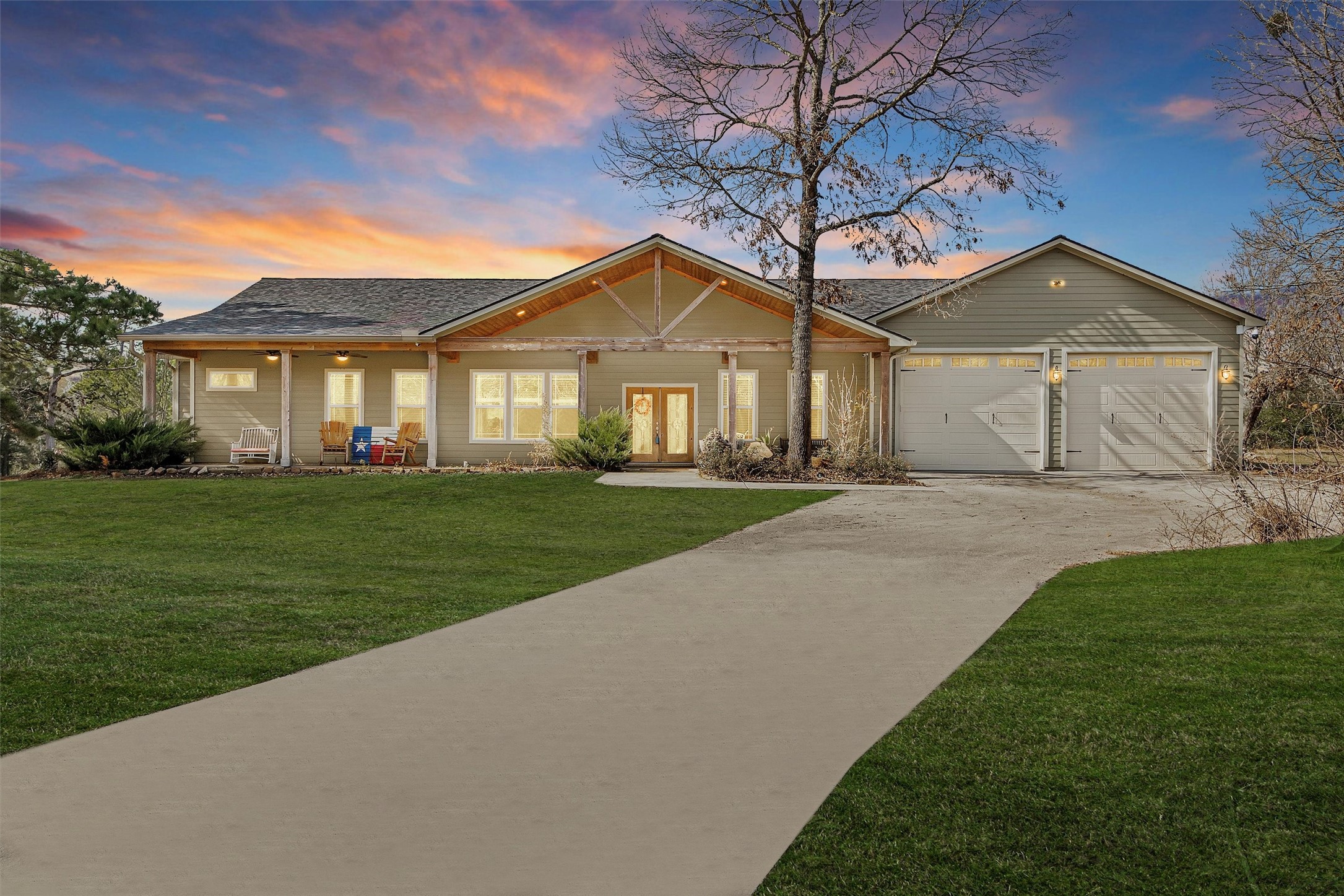 12225 High Fire Road Montgomery, TX 77356 - Photo 1 of 45 a front view of a house with a yard and trees