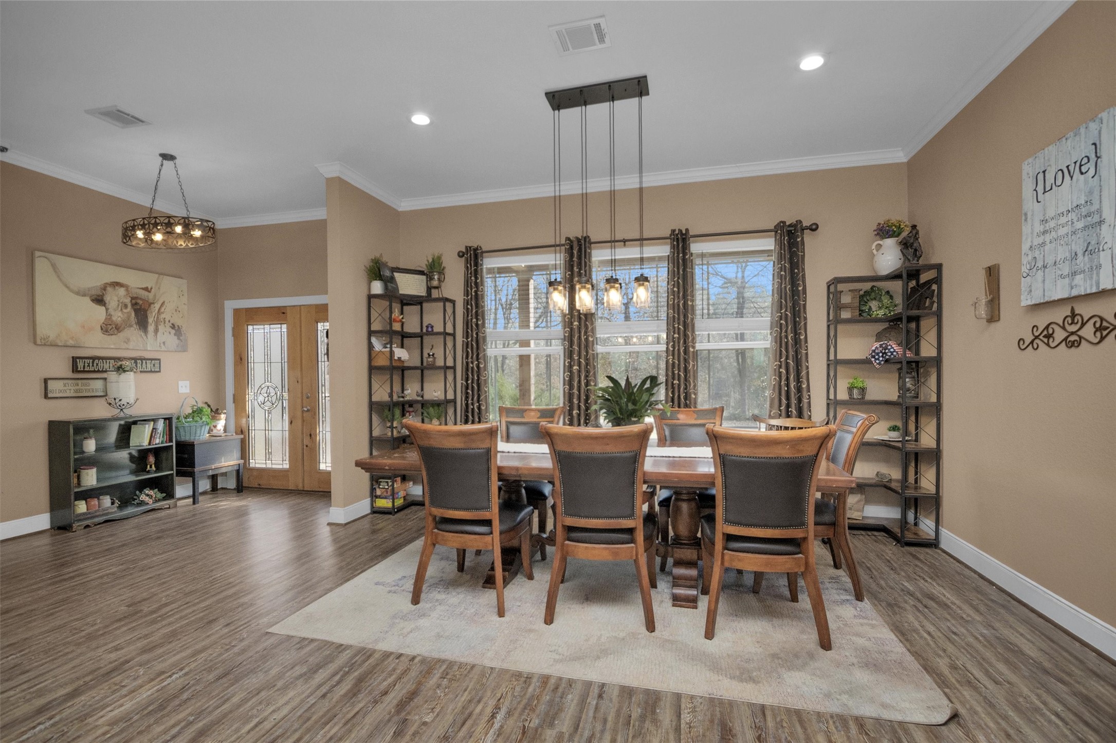 12225 High Fire Road Montgomery, TX 77356 - Photo 11 of 45 a dining room with furniture a chandelier and wooden floor