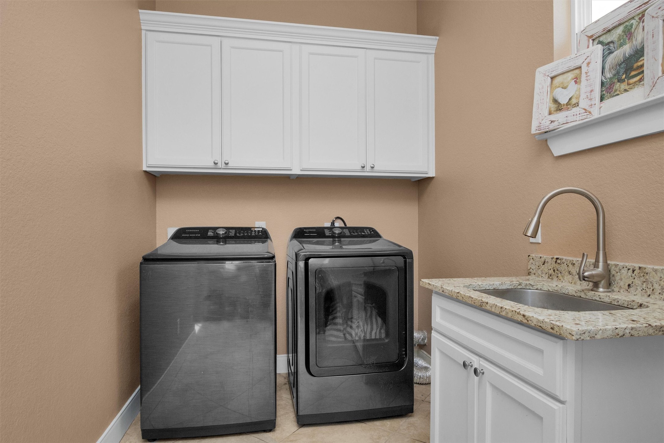 12225 High Fire Road Montgomery, TX 77356 - Photo 20 of 45 a close view of a sink and washing machine in a kitchen