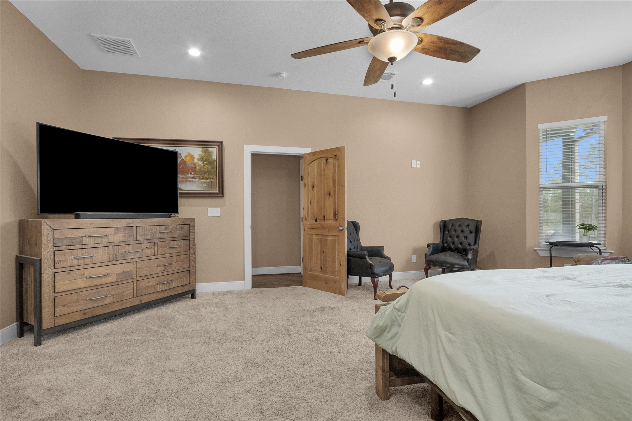 12225 High Fire Road Montgomery, TX 77356 - Photo 21 of 45 a bedroom with a bed and a flat screen tv