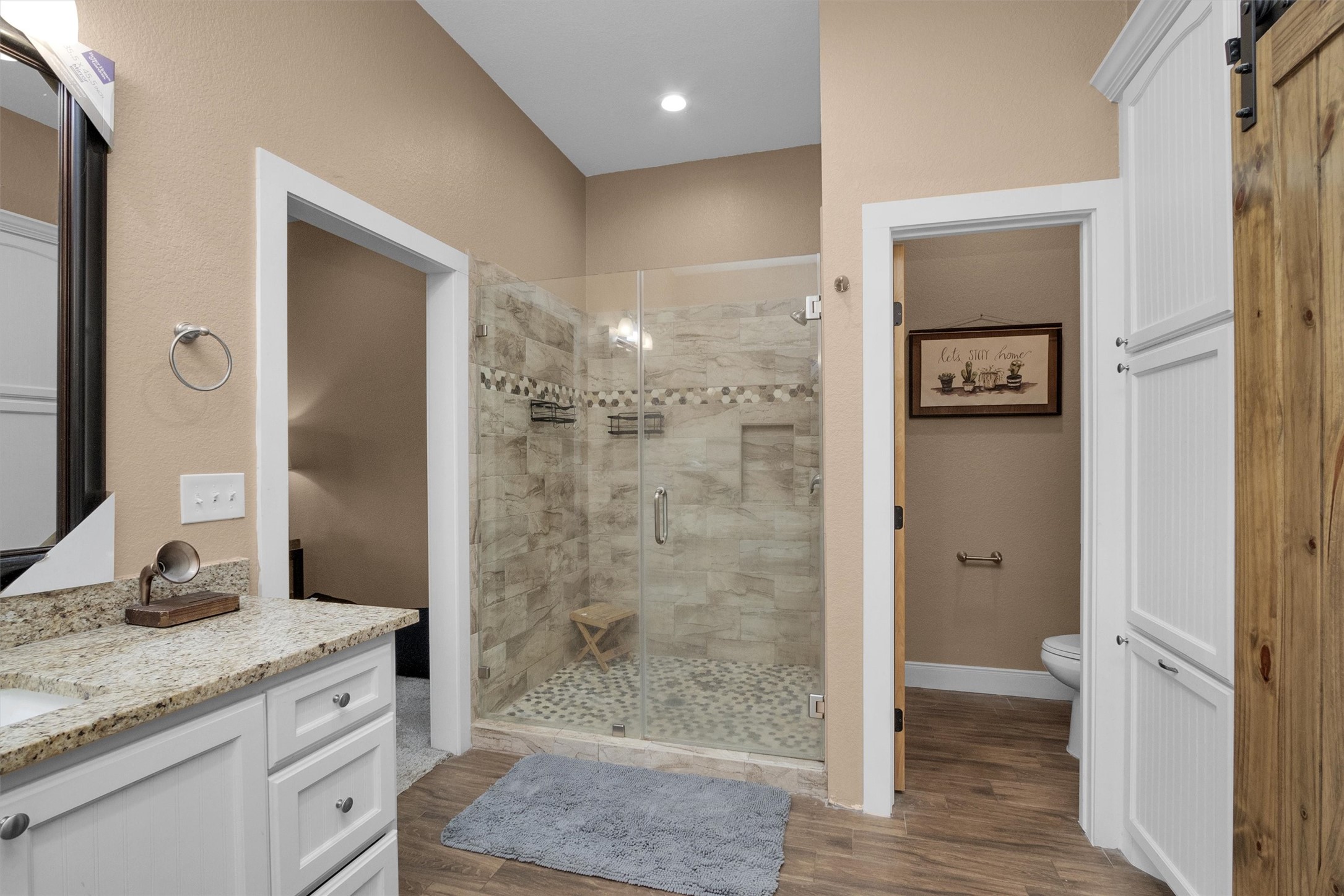 12225 High Fire Road Montgomery, TX 77356 - Photo 25 of 45 a bathroom with a granite countertop sink toilet and shower