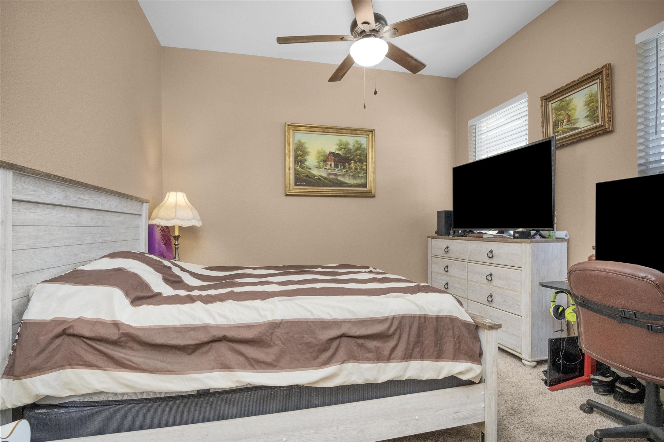 12225 High Fire Road Montgomery, TX 77356 - Photo 27 of 45 a bedroom with a bed and a flat screen tv