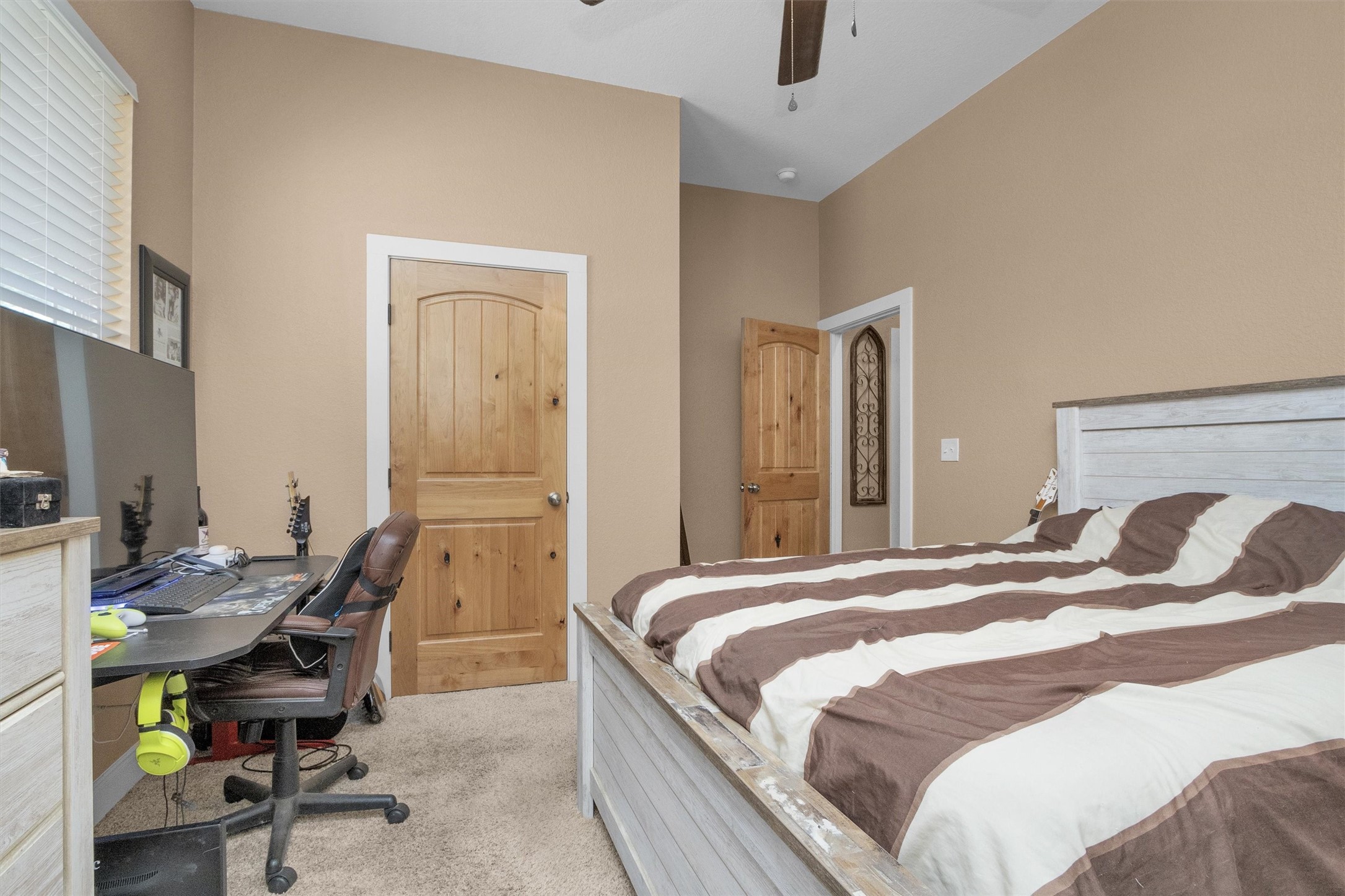 12225 High Fire Road Montgomery, TX 77356 - Photo 28 of 45 a bedroom with a bed a desk and chair