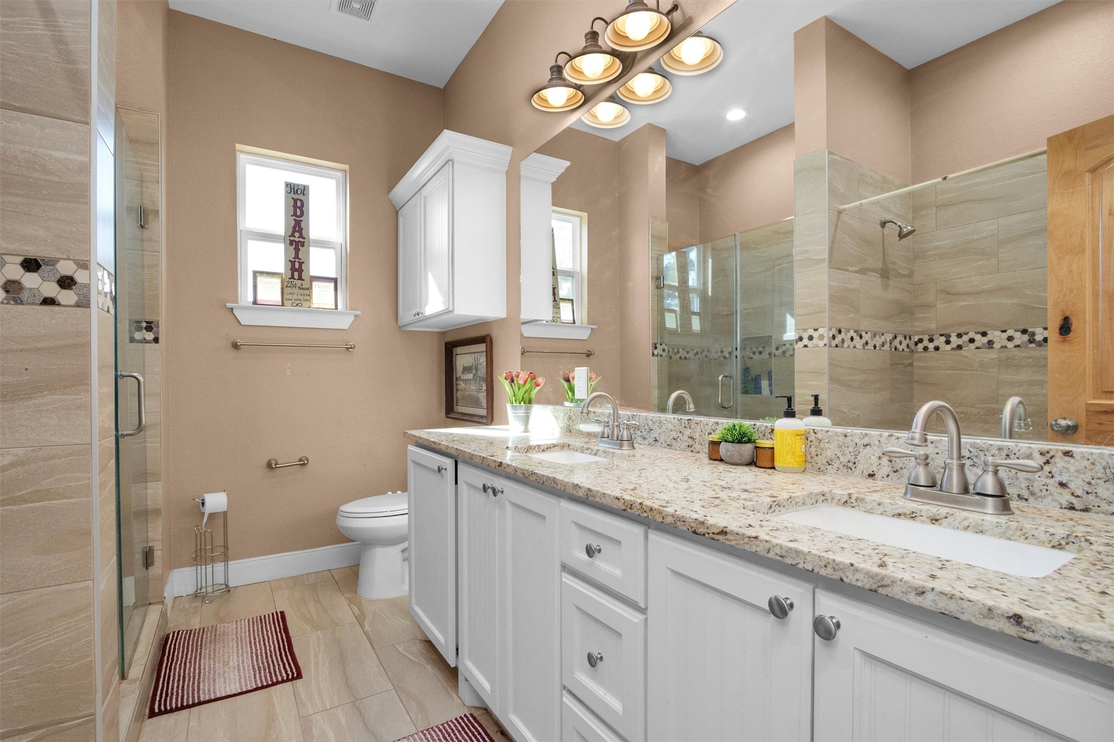 12225 High Fire Road Montgomery, TX 77356 - Photo 29 of 45 a bathroom with a granite countertop sink a toilet and a mirror
