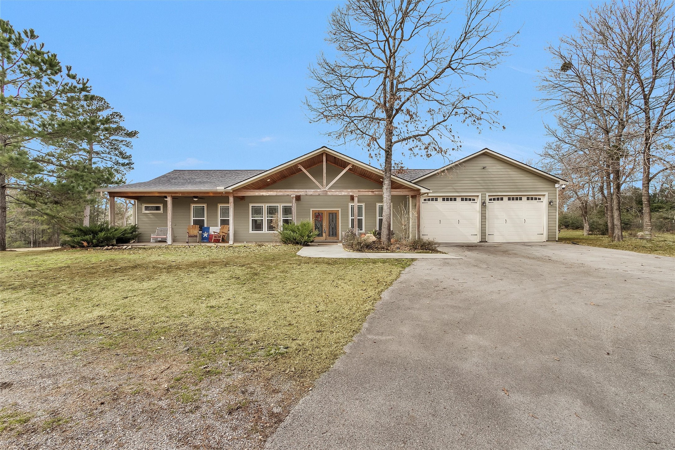 12225 High Fire Road Montgomery, TX 77356 - Photo 3 of 45 a front view of a house with a yard and garage