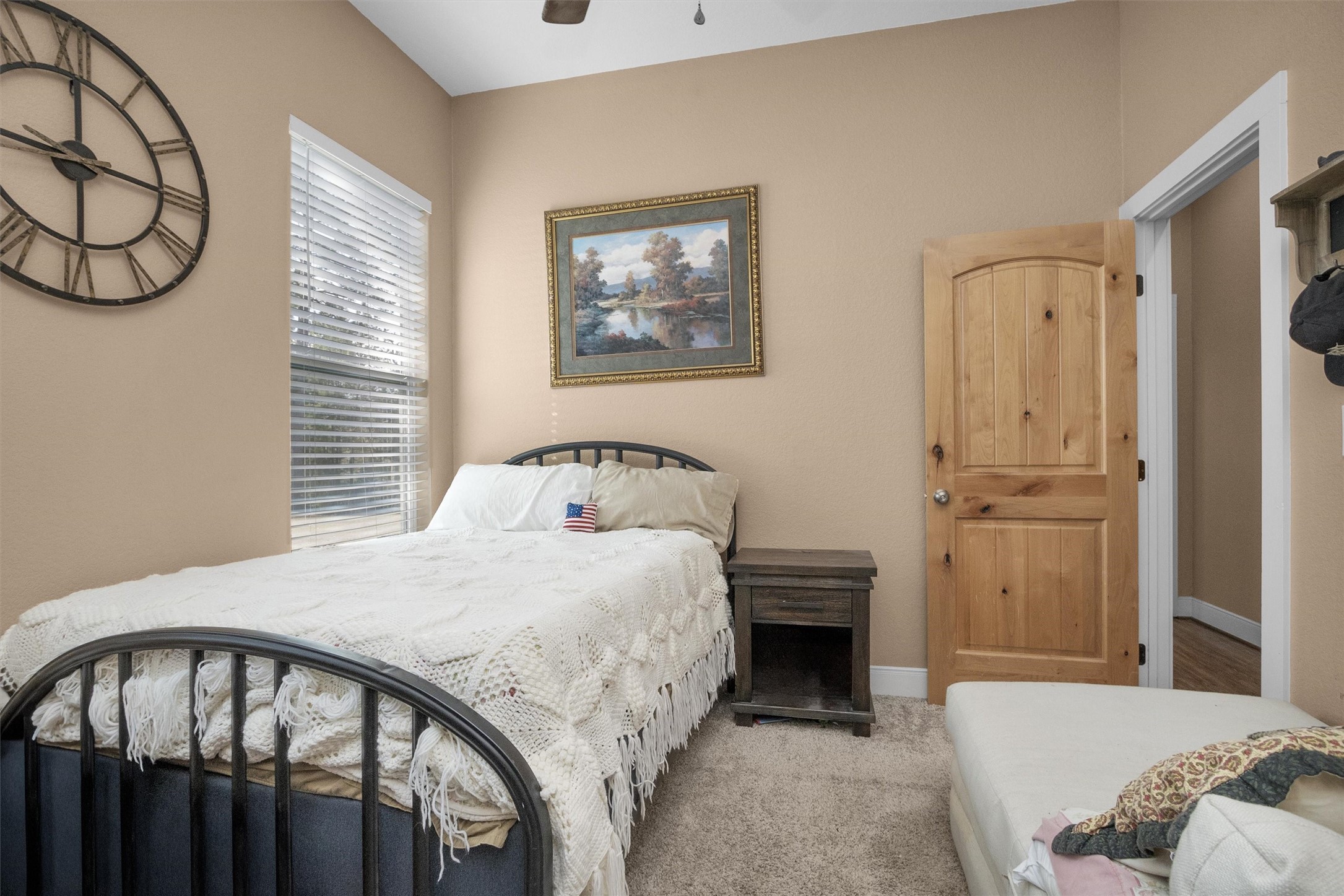 12225 High Fire Road Montgomery, TX 77356 - Photo 32 of 45 a bedroom with a bed and a table in it