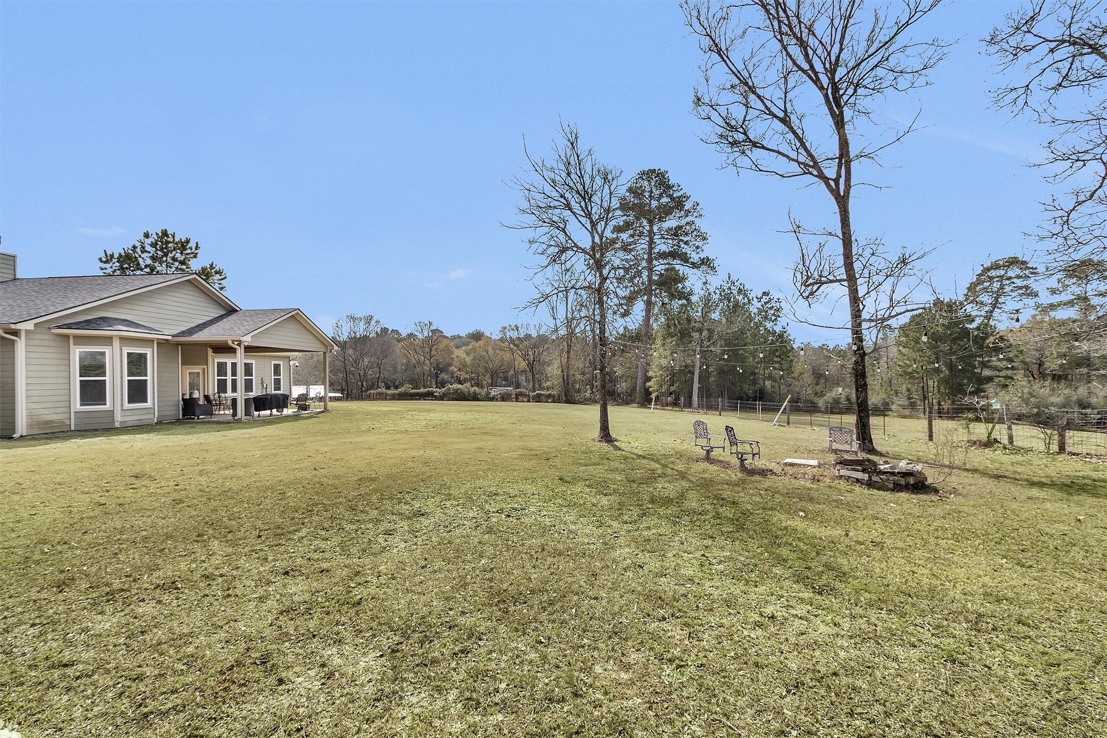 12225 High Fire Road Montgomery, TX 77356 - Photo 38 of 45 a house with trees in front of it