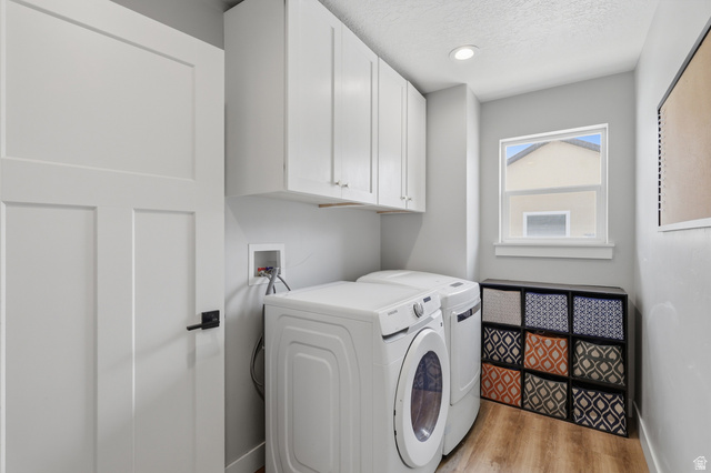 625 East 100 South Ephraim, UT 84627 - Photo 4 of 26 Laundry area featuring overhead white cabinetry, wood-finish flooring, a contemporary window, and recessed lighting