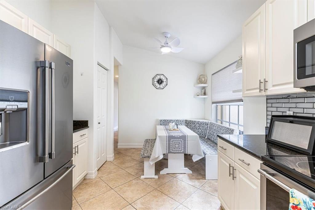 1630 Triangle Palm Terrace Naples, FL 34119 - Photo 8 of 24 a kitchen with a sink appliances and cabinets
