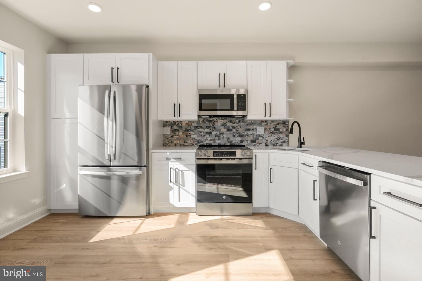 2709 Priya, Unit A76 Philadelphia, PA 19131 - Photo 2 of 29 Modern kitchen with sleek finishes.