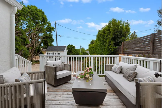 a balcony view with a sink and potted plants