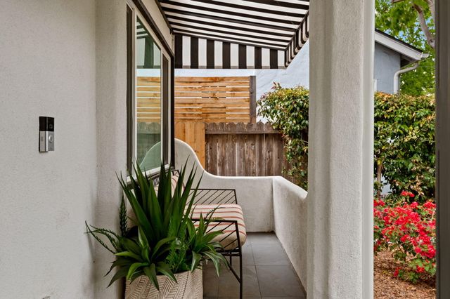 a view of a backyard with plants and a garden