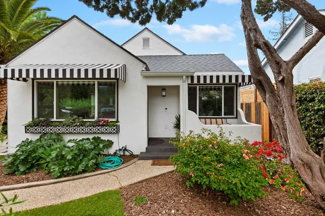 front view of a house with a garden