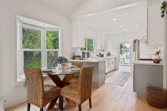 a view of a dining room with furniture and window