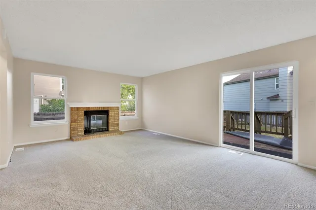 an empty room with fireplace