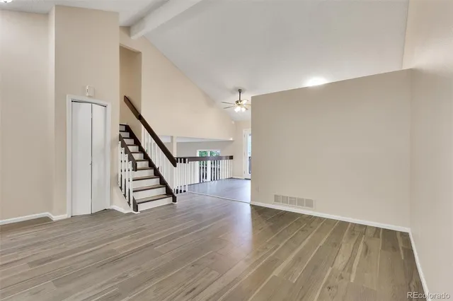 a view of wooden floor and stairs in a room