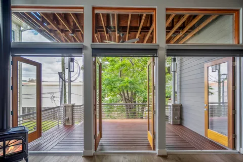 a view of living room kitchen and entryway