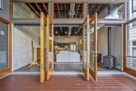 a view of front door with wooden floor