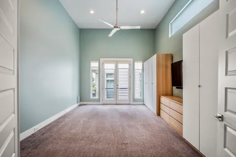 a view of an empty room with closet area