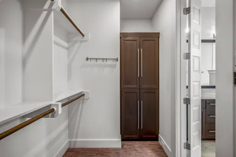 a view of an entryway with wooden floor