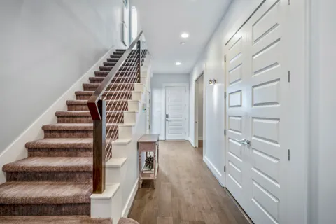 a view of a balcony with wooden floor